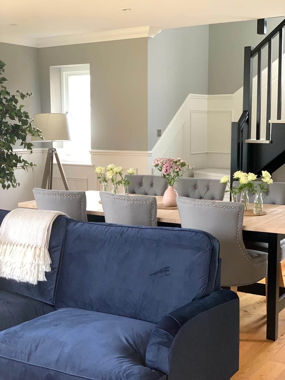 Redecorated dining room with painted wood panelling and sage grey walls in Bramdean, Hampshire
