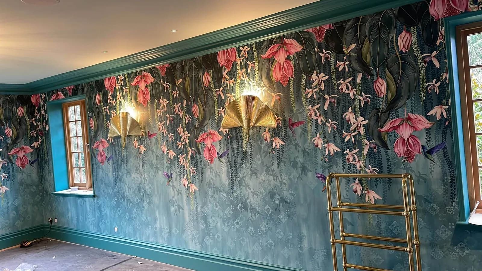 Floral mural wallpaper feature wall with teal painted cornice and skirting, decorated by Bourne Decorators in Binstead, Hampshire